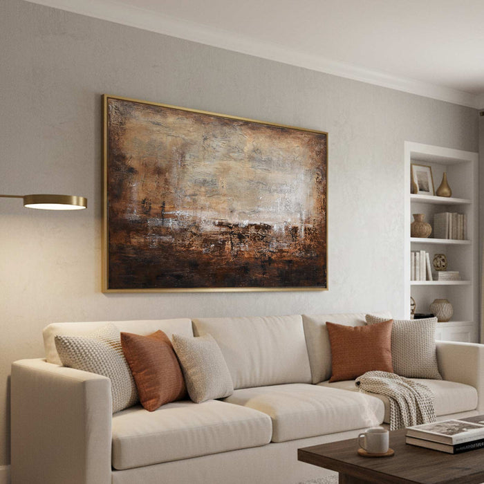 Modern living room with a beige sofa, abstract painting, and bookshelf.
