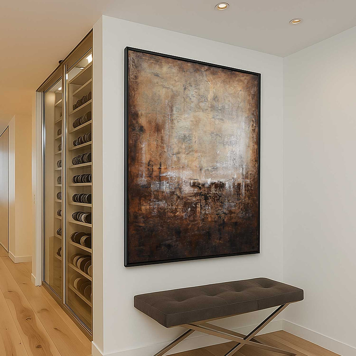 Wine cellar with glass door, abstract painting on wall, and brown bench.