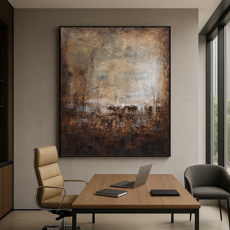 Modern office interior with a large abstract painting, desk, chairs, and laptop.