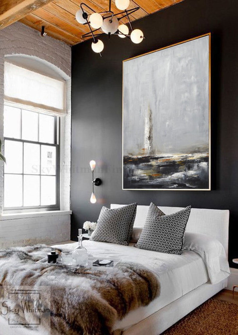 seascape light house painting above bed