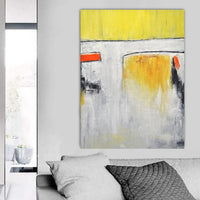 yellow abstract painting on wall